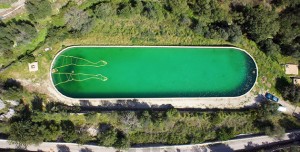 Draws bathing man using floating pool tubes