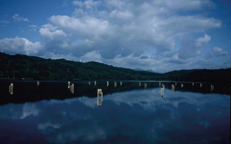 A series of chairs invade Japanese lake by Hidemi Nishida