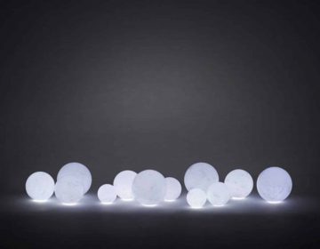 Moon-Like vases made from layered wax by we+