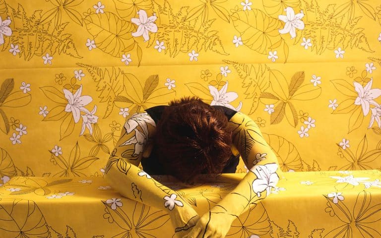 Camouflages Herself Into Floral Wallpaper And Fabric