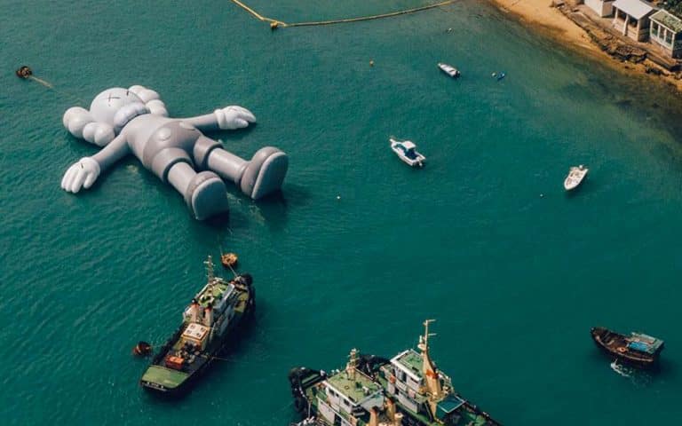 Kaws sculpture floating in Hong Kong’s Victoria harbor