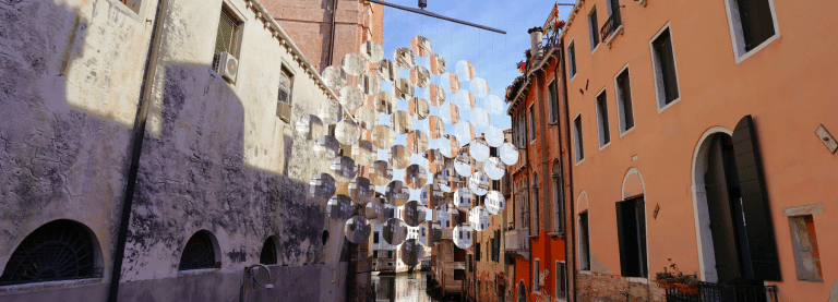 Vincent Leroy imagines giant mobile of magnifying glass floating above venetian boats