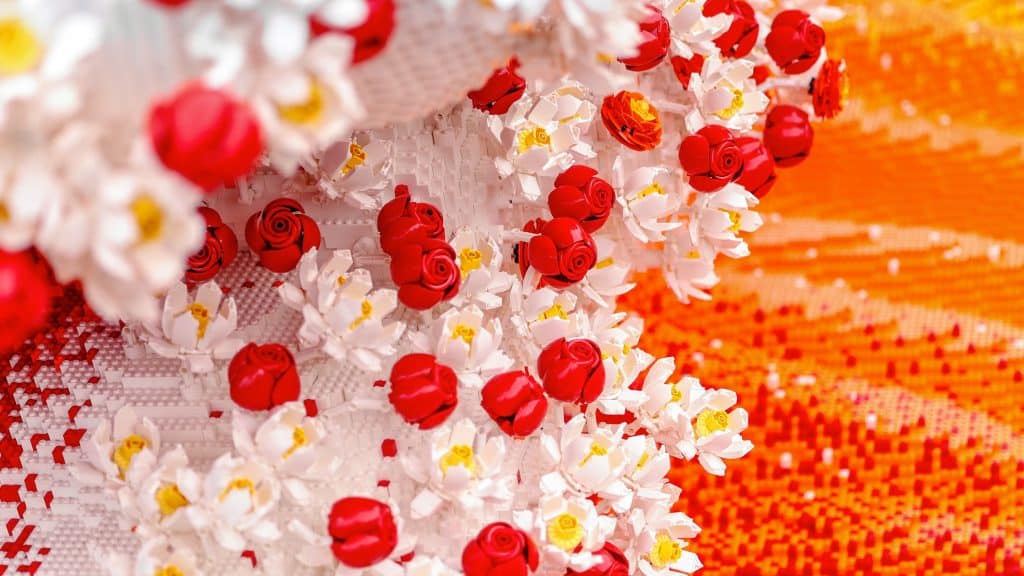 Close up of LEGO brick flowers in red, white and orange
