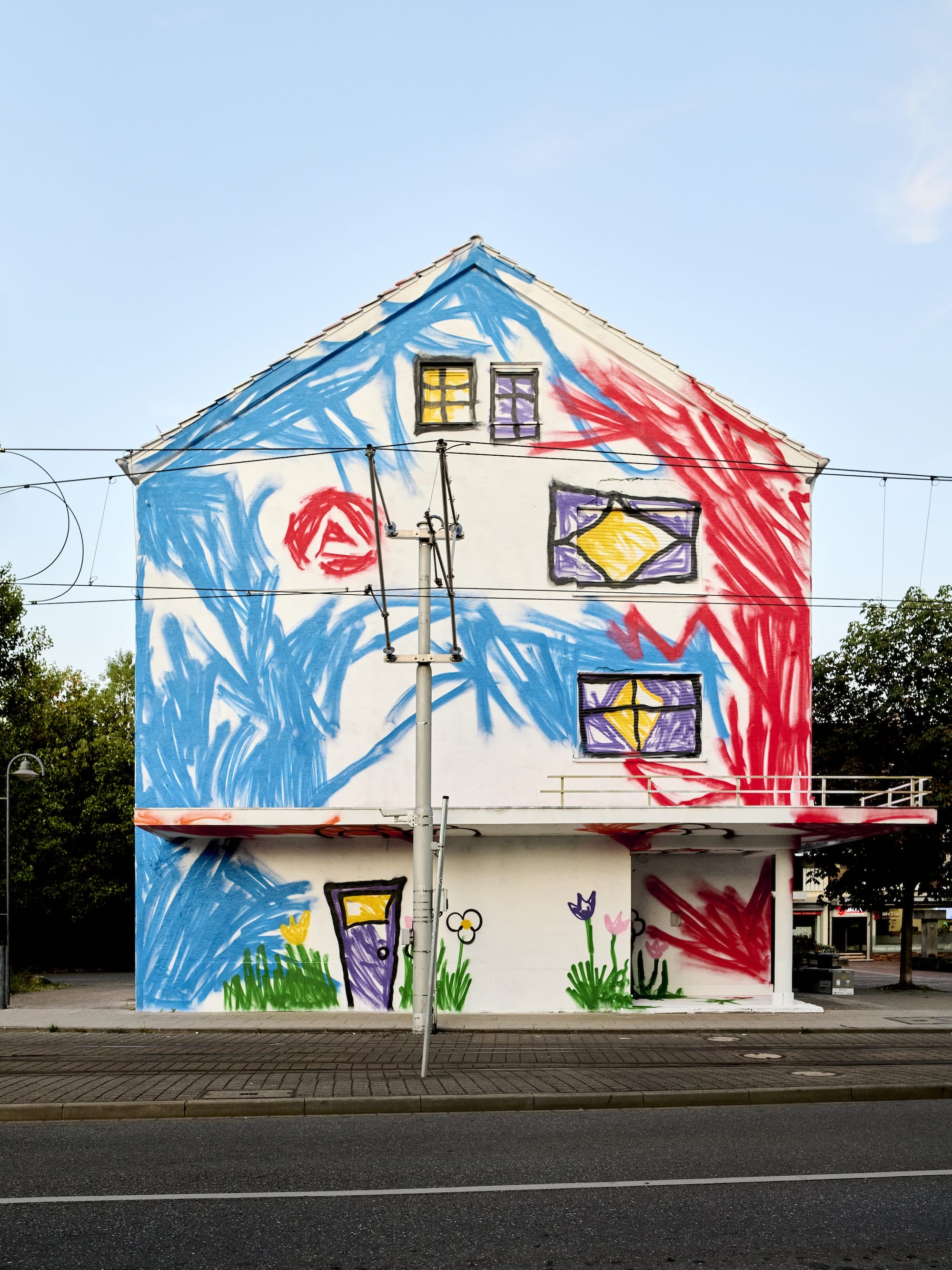An empty house in Stuttgart painted by The Wa to look like a child's crayon drawing, PFFFestival 2026